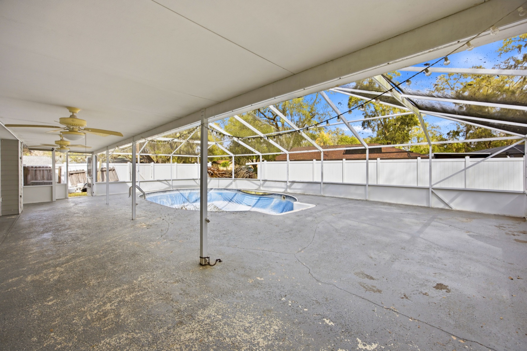 Screened pool enclosure and covered lanai at 2580 SE 37th St Ocala FL - 1,223 sq ft outdoor living area with ceiling fans